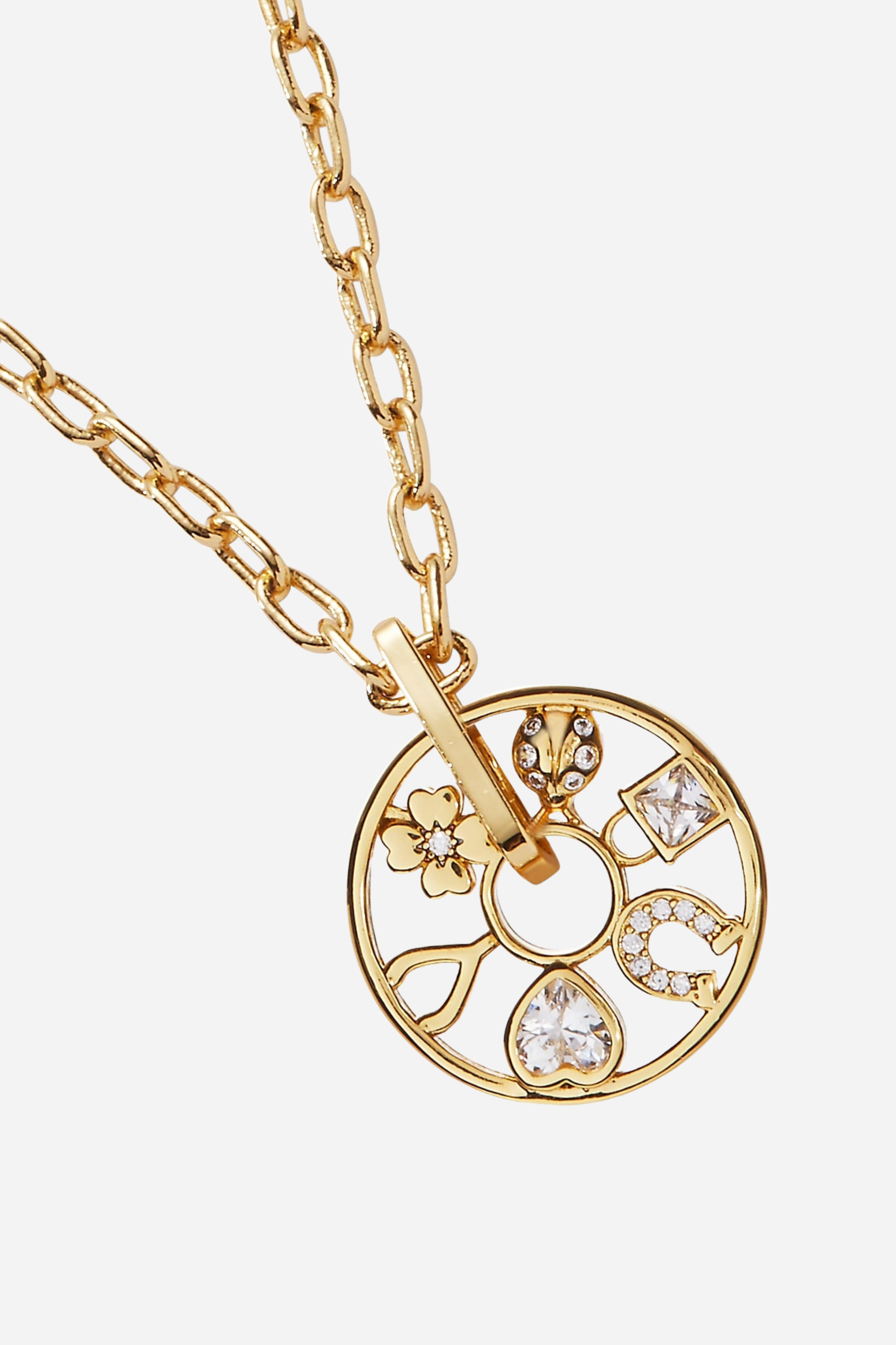 Dainty gold-plated Love & Luck wheel necklace with crystal details and adjustable chain, featuring whimsical lucky symbols inspired by equestrian charm jewelry.

These Love and Luck Wheel Charm Necklace has six crystal-accented lucky symbols: a four-leaf clover, a ladybug, a lock, a wishbone, a horseshoe and a sparkling heart, all on a wheel-shaped charm that spins around an adjustable-length necklace chain.