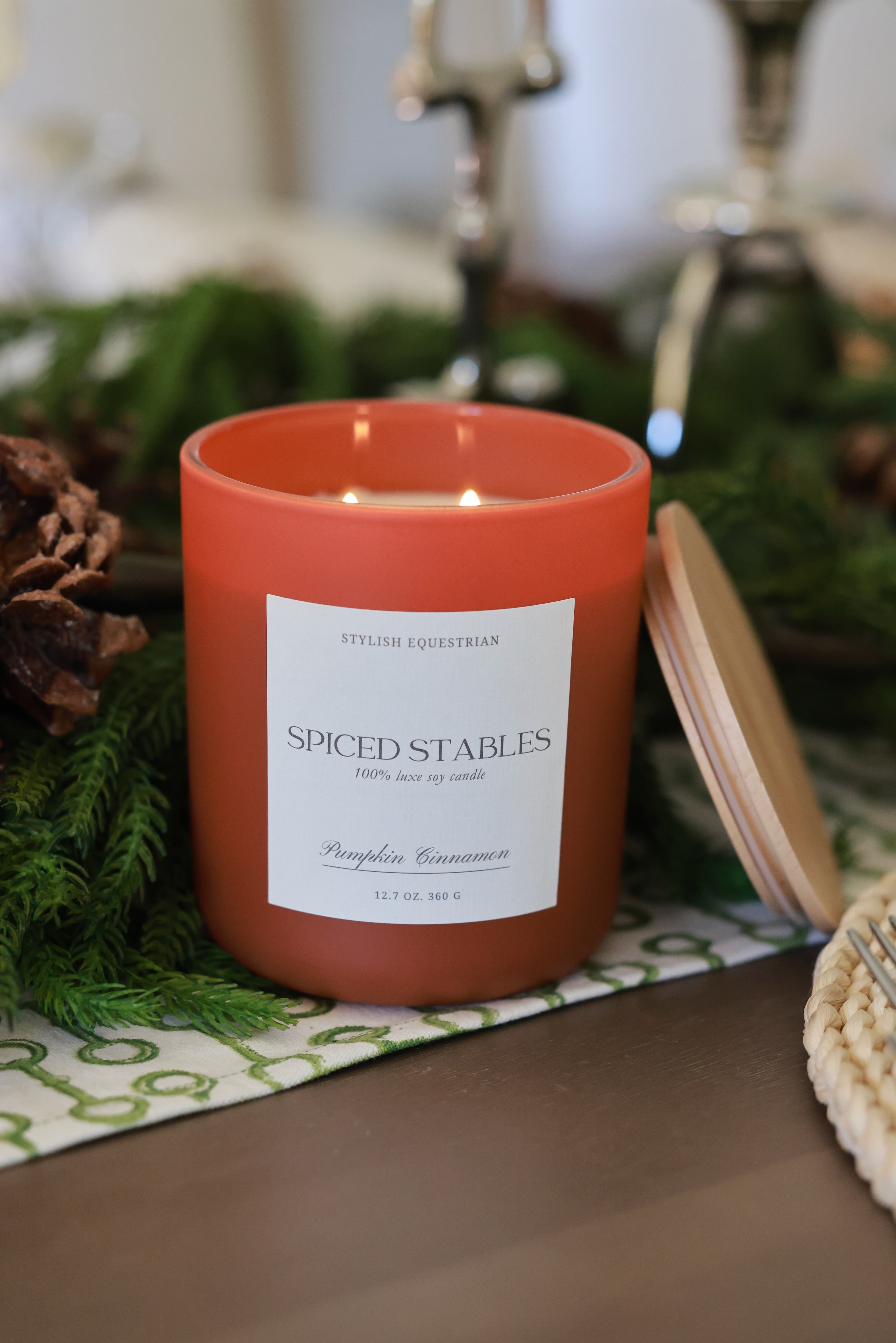 Luxe Signature Candle – Spiced Stables edition, a handmade 100% soy wax candle in a frosted matte glass vessel with wooden lid. Features a warm pumpkin cinnamon scent with notes of chai and vanilla—perfect for cozy autumn nights. Elegant equestrian-inspired home accent with 60+ hour burn time. Made in the USA. equestrian decor and home accents, horse themed candle, gifts for horse lovers, luxury soy candle, pumpkin cinnamon candle, Spiced Stables candle, fall equestrian home fragrance