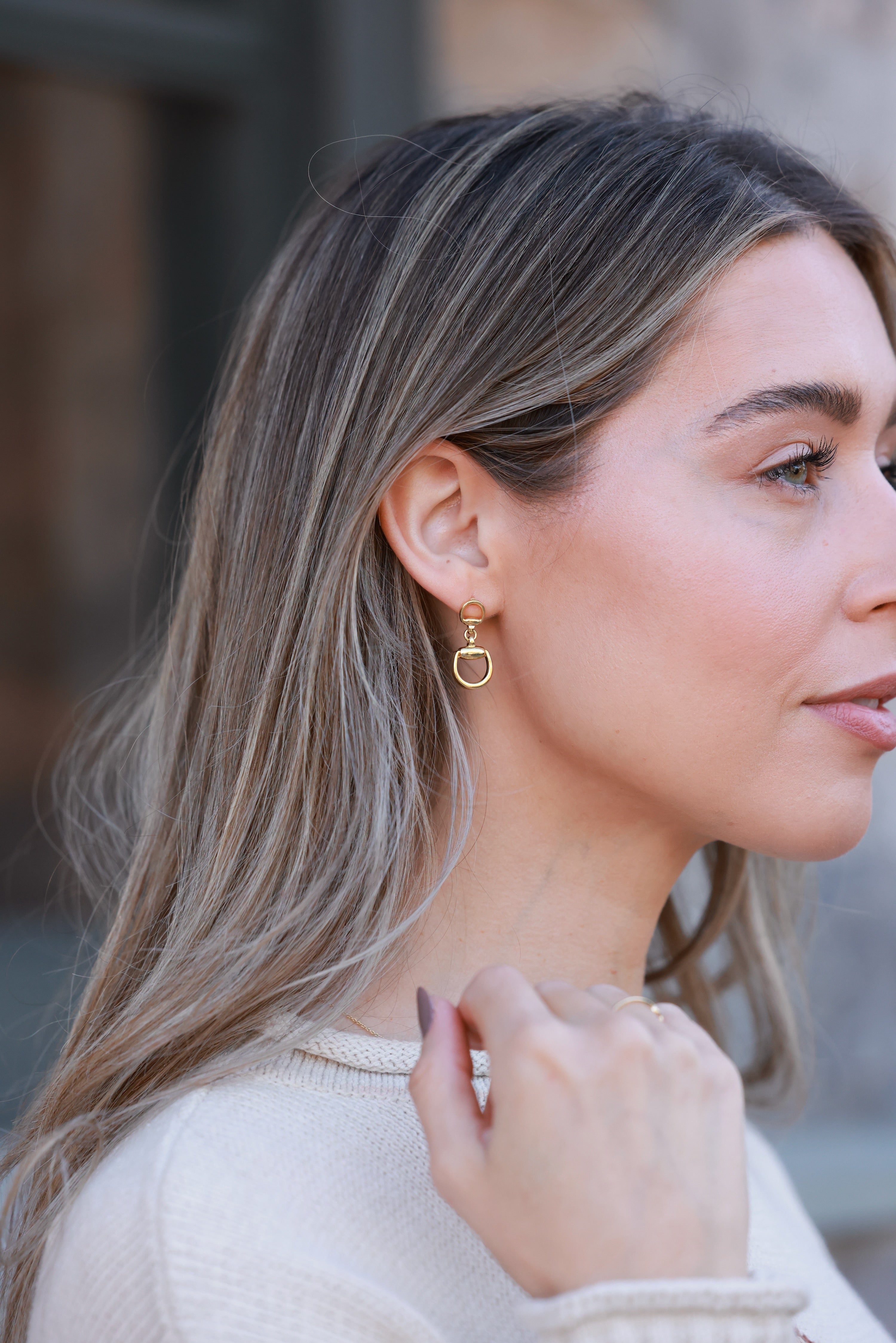 Gold d-ring drop earrings with interlocking circular links, minimalist 18k gold statement jewelry, modern equestrian-inspired earrings for women.