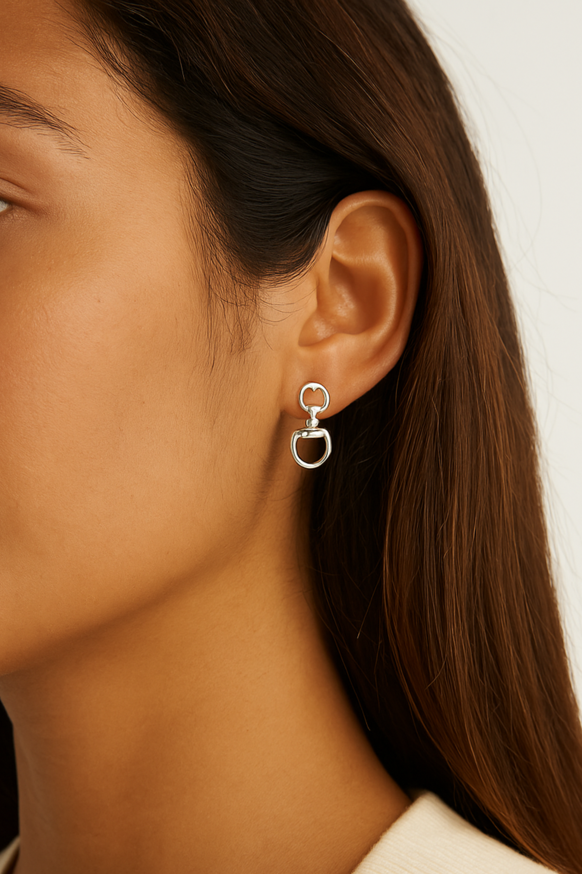 Silver equestrian drop earrings with interlocking D-ring design, minimalist horse bit jewelry, lightweight statement earrings for women, elegant gift for horse lovers.