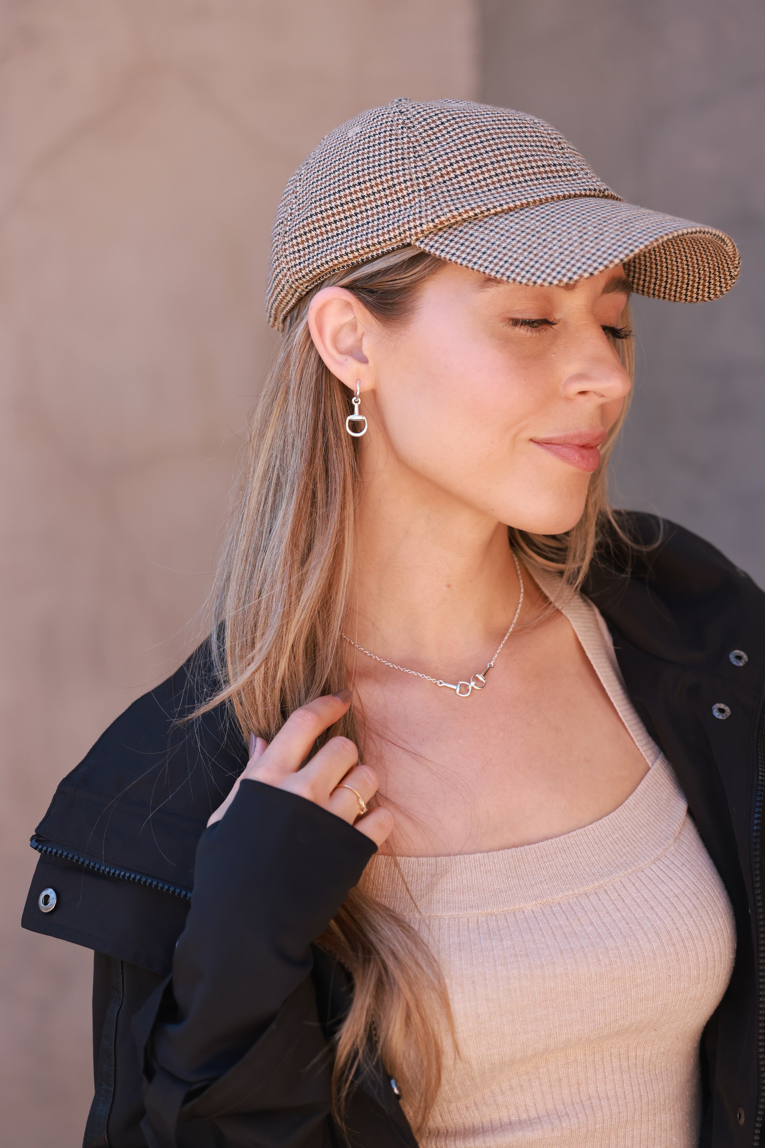 Silver equestrian huggie hoop earrings with stirrup design, lightweight horse bit jewelry, dainty horse girl earrings, elegant gift for equestrian lovers.