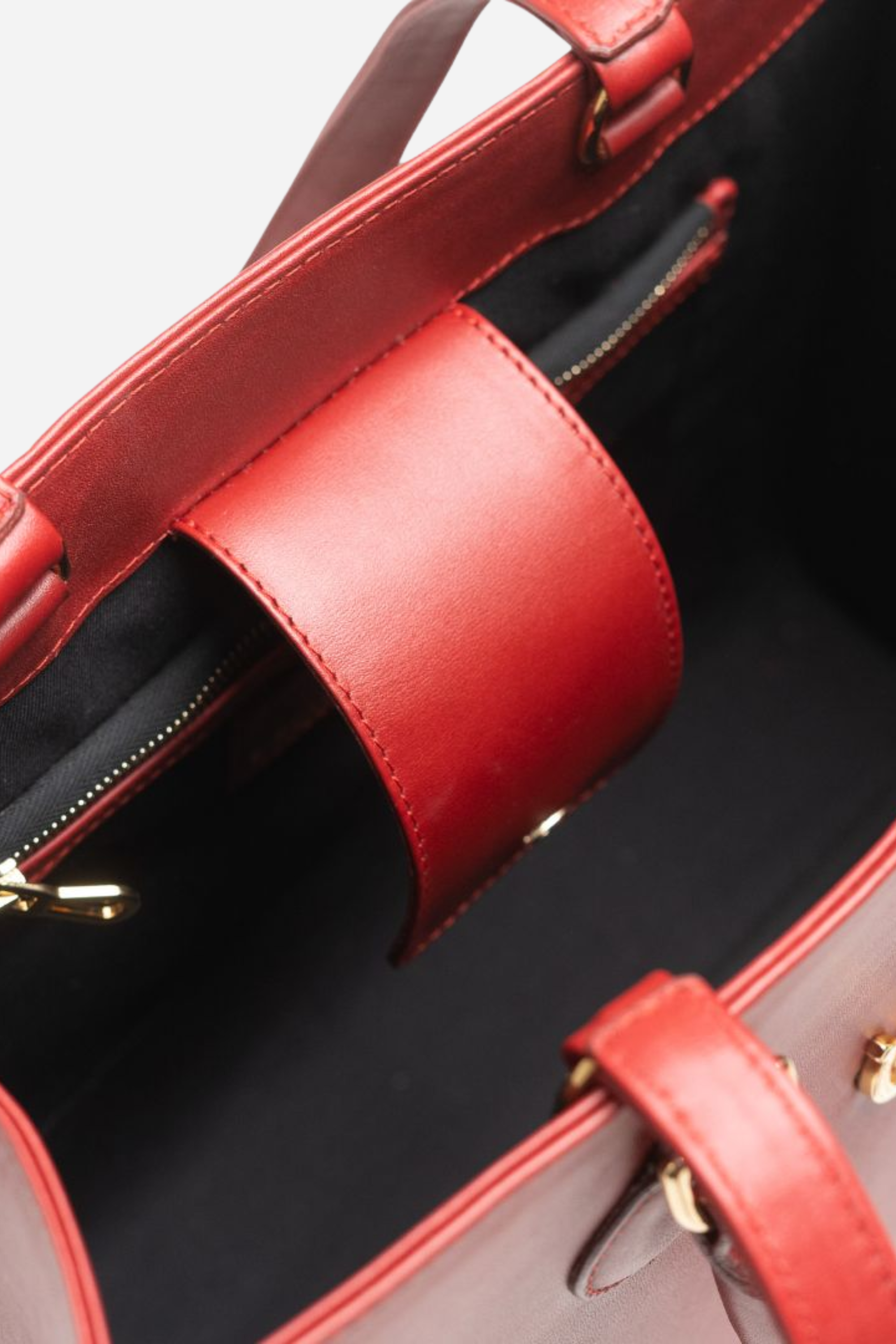 Spacious equestrian leather tote bag with a classic silhouette, gold hardware, interior compartments, and convertible top-handle or shoulder straps.