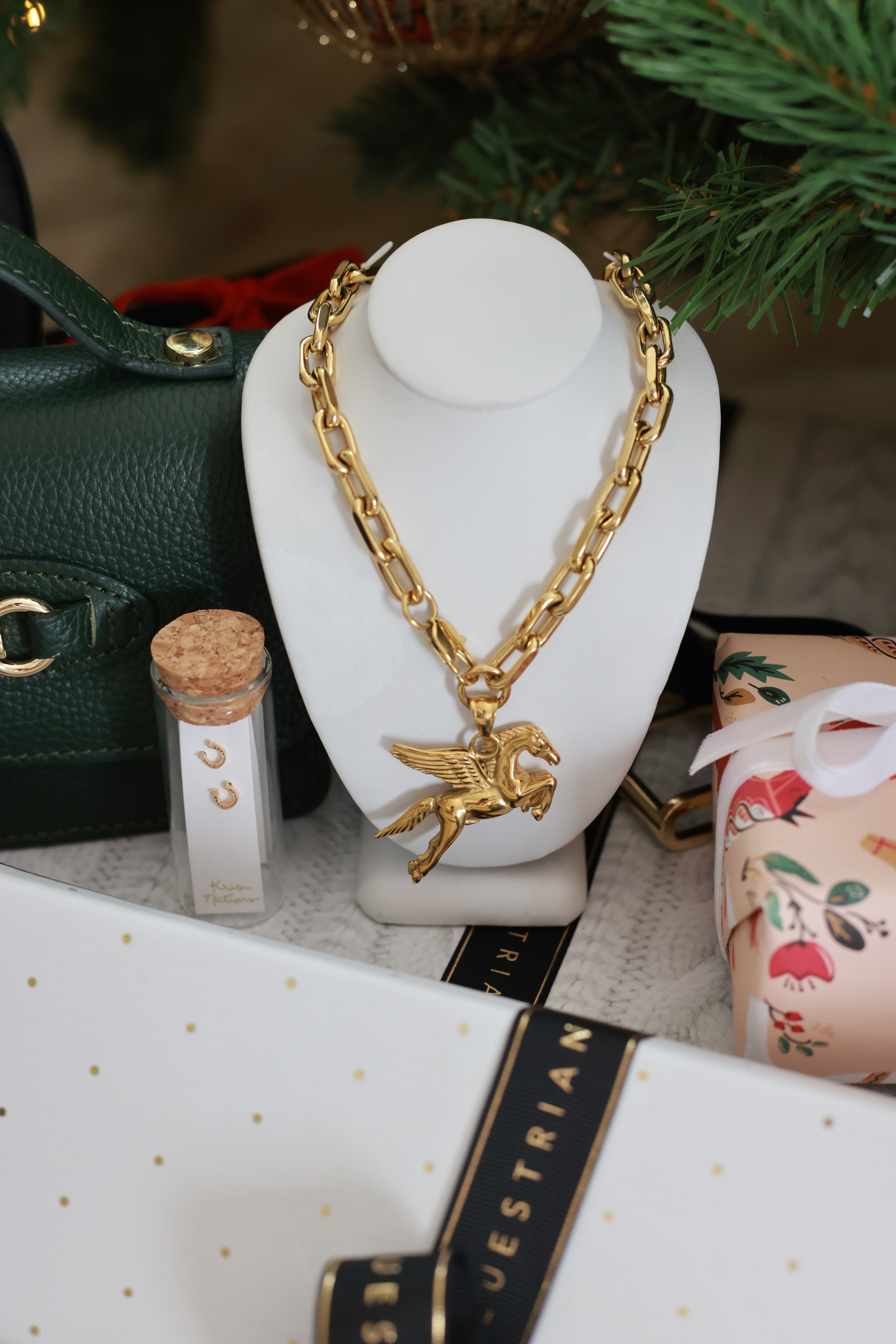 Pegasus Pendant Necklace — a bold equestrian statement piece featuring a winged horse symbolizing freedom and strength. Handcrafted from solid stainless steel and plated in 18k gold with a 1¾” pendant. A luxurious mythical-inspired necklace perfect for horse lovers and equestrian fashion enthusiasts. equestrian accessory, horse themed jewelry, Pegasus necklace, chunky equestrian necklace, gold horse pendant, luxury equestrian jewelry, mythical horse necklace, statement equestrian accessory