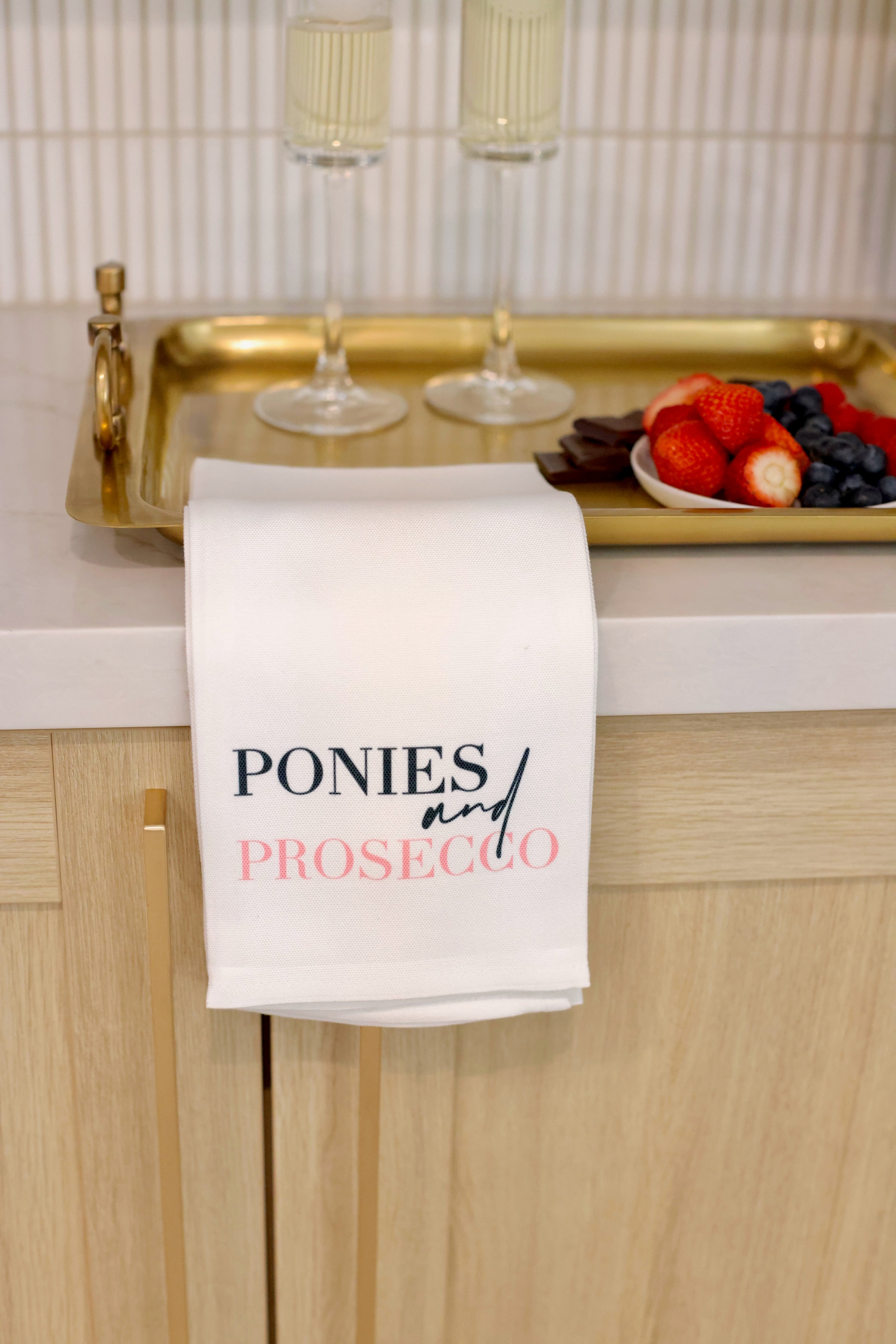 toss designs stylish equestrian ponies and prosecco hand towel