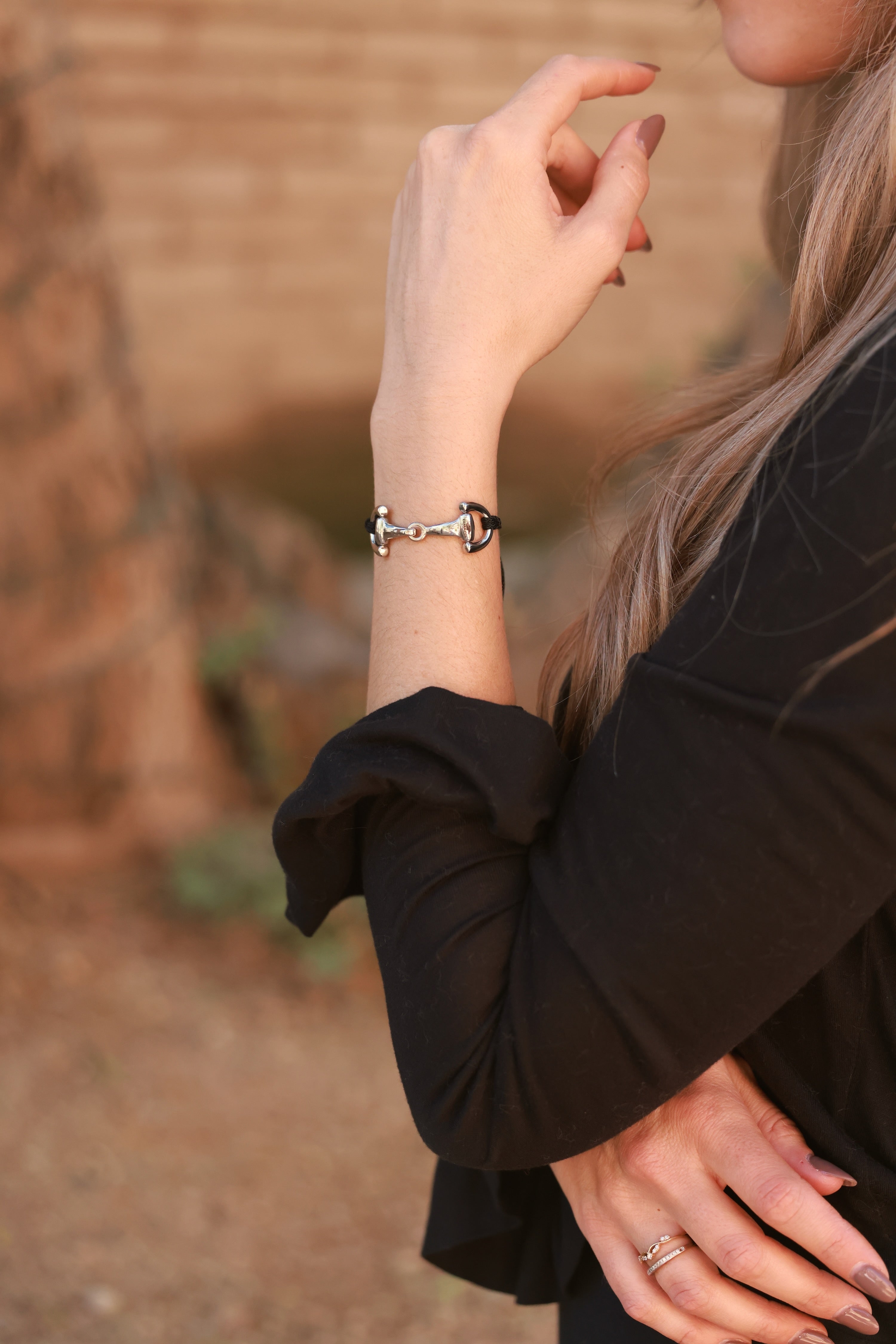 Black Pony Bracelet from Stylish Equestrian x Dimacci, handmade in Germany with an adjustable nylon band and polished stainless steel snaffle bit accent. A dainty equestrian-inspired bracelet perfect for layering or gifting to horse lovers.