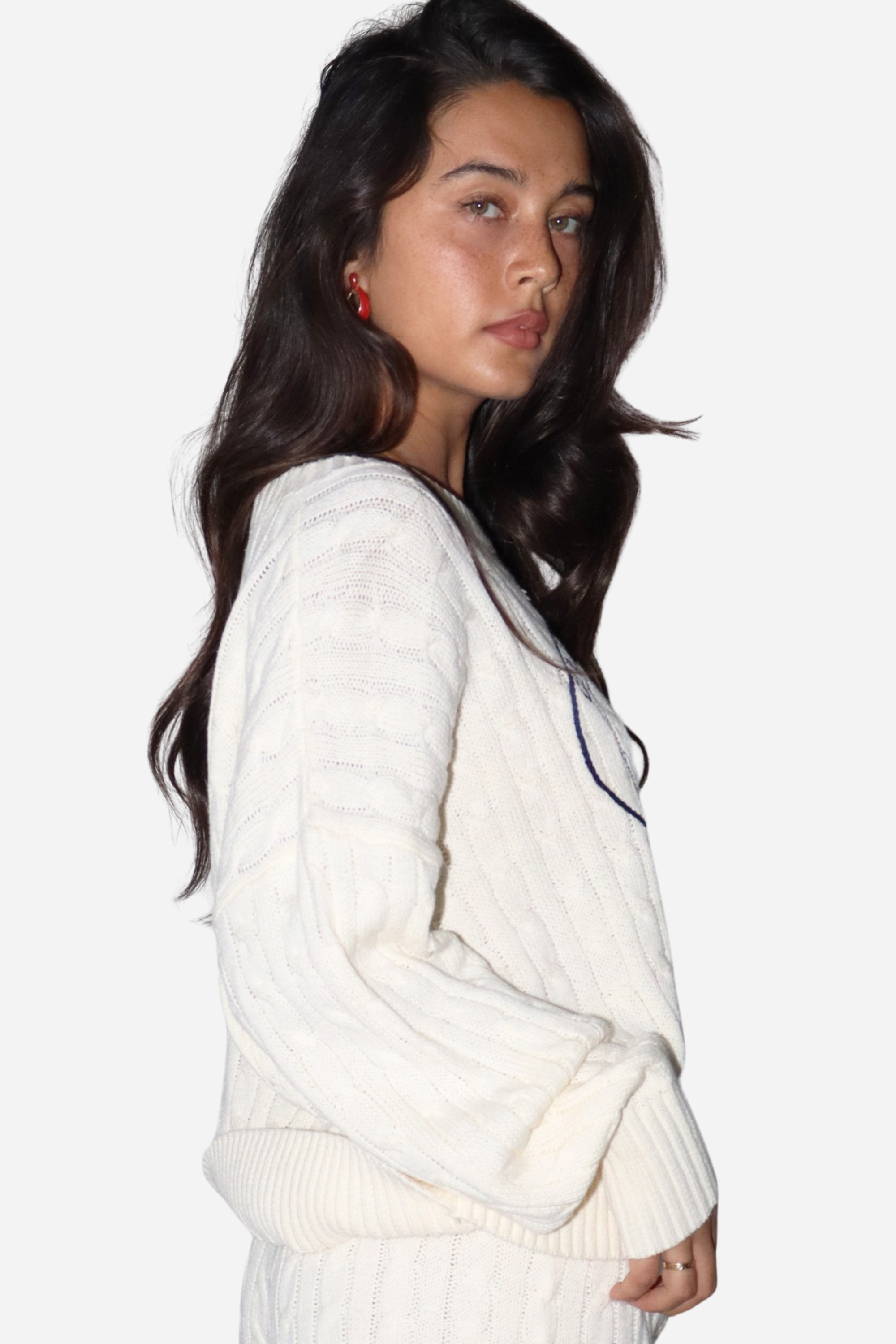 The Girls Rodeo Club Sweater blends classic varsity style with timeless equestrian charm. Designed with a relaxed dropped-shoulder silhouette and finished with textured cable-knit detailing, this cozy knit delivers effortless western sophistication, whether you're at the barn, in town, or layered for cool spring rides. Featuring navy embroidered varsity lettering across a soft cream knit, this sweater captures the spirit of rodeo heritage with a modern cowgirl feel.
