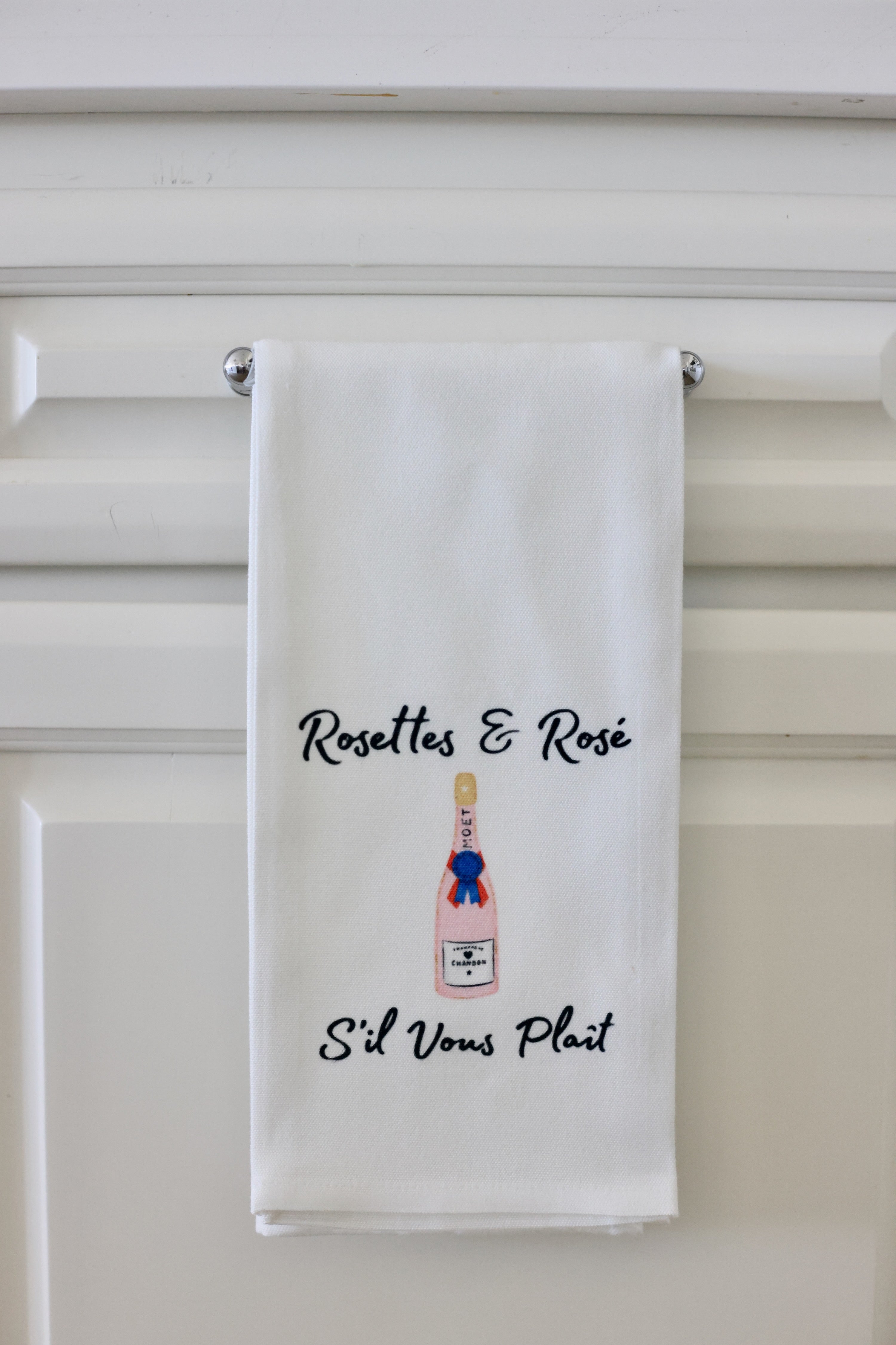 White towel with 'Rosettes & Rosé' text and bottle graphic on a white background - equestrian kitchen and dining, horse themed linen, equestrian hosting
