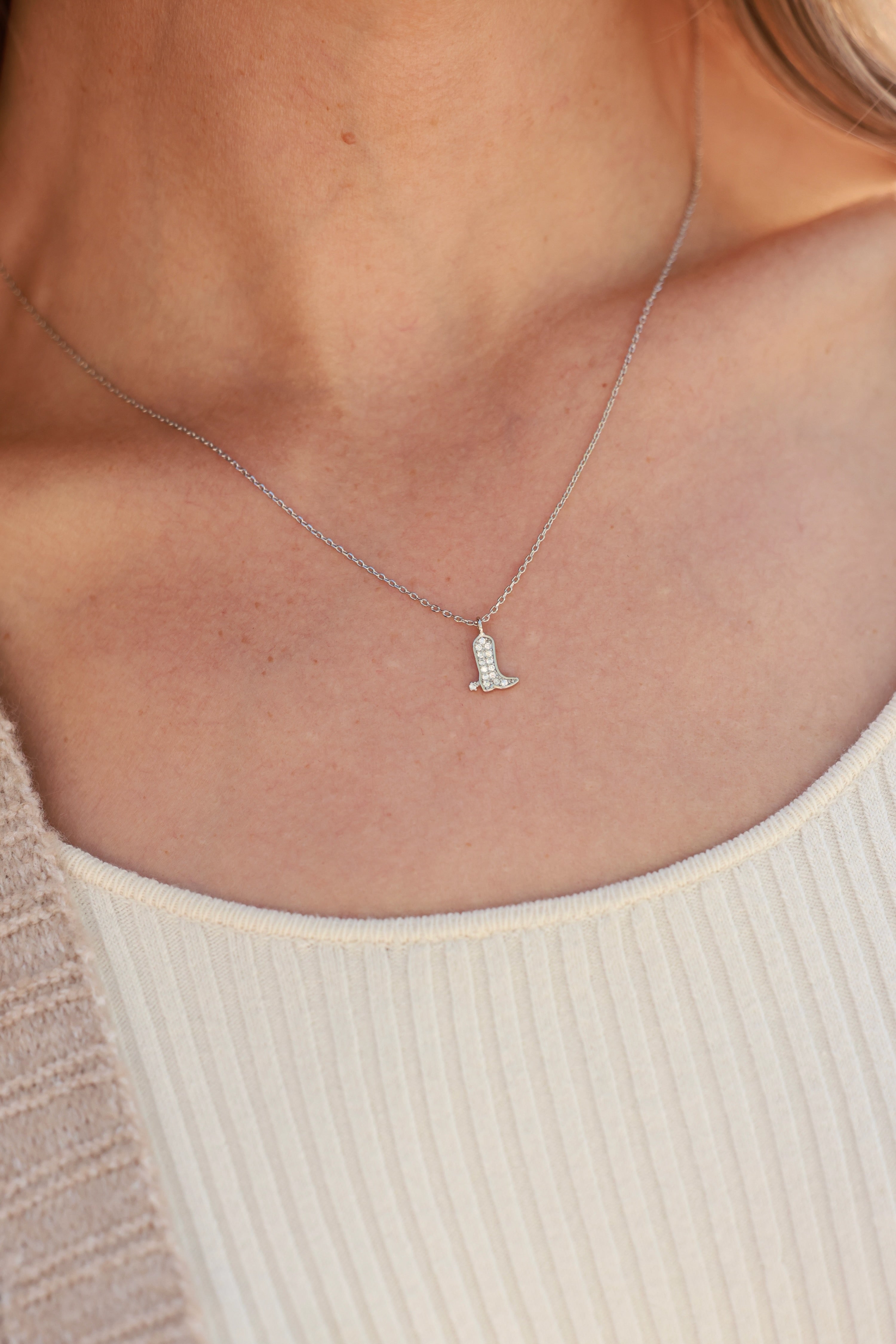 Sadie Boot Necklace in sterling silver featuring a delicate chain with a tiny western boot charm adorned with CZ pavé detail. Dainty equestrian-inspired jewelry that adds a subtle sparkle — a perfect gift for horse lovers.