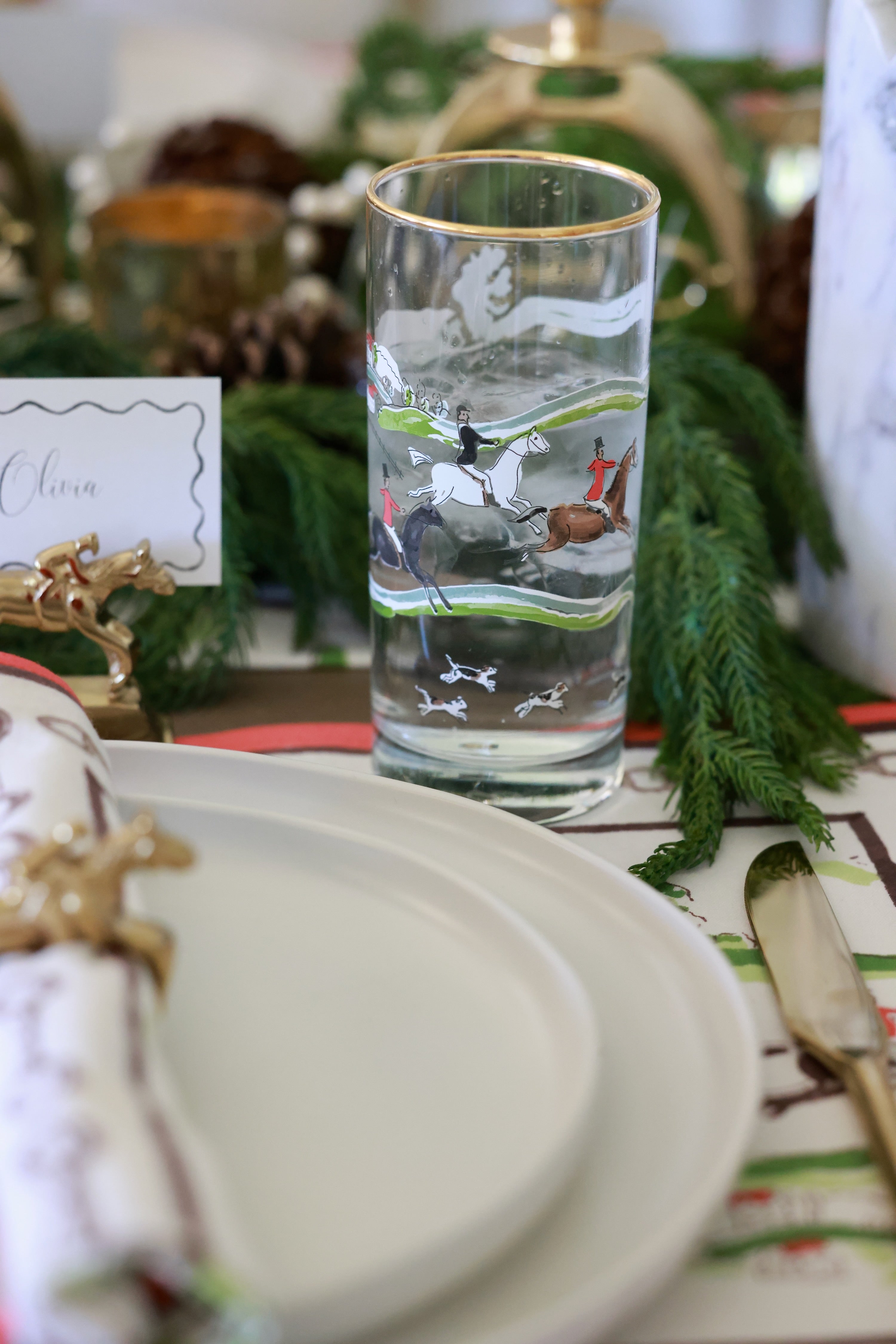 pomegranate inc stylish equestrian the hunt scene tall drinking glass set The Hunt Scene Drinking Glass Set featuring four tall glasses adorned with a detailed equestrian hunt scene and finished with elegant gold rims. A sophisticated horse-themed glassware set perfect for entertaining or gifting.