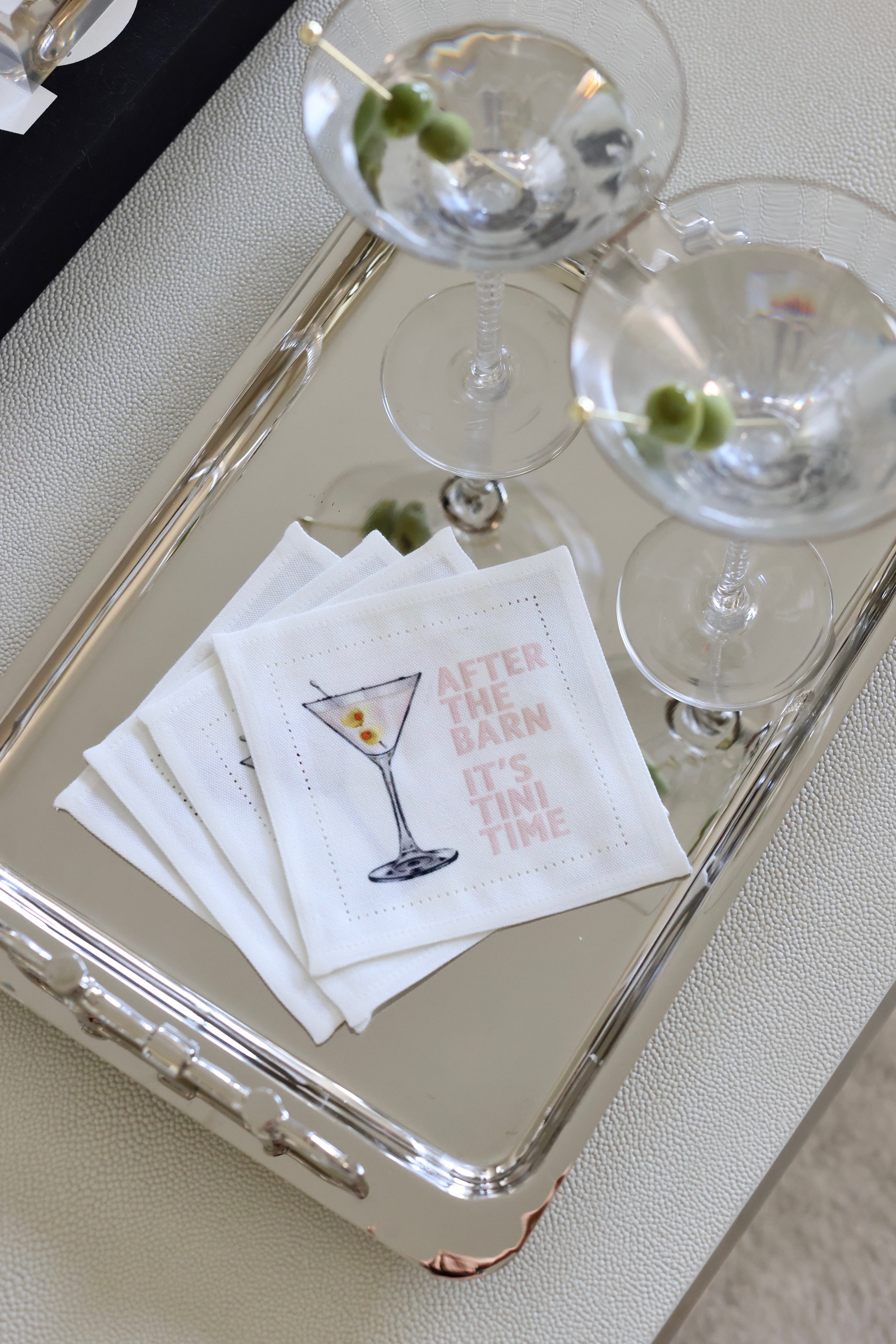 Two martini glasses on a tray with cocktail napkins featuring a humorous message. - equestrian kitchen and dining, horse themed linens, equestrian hand towel, martini napkin