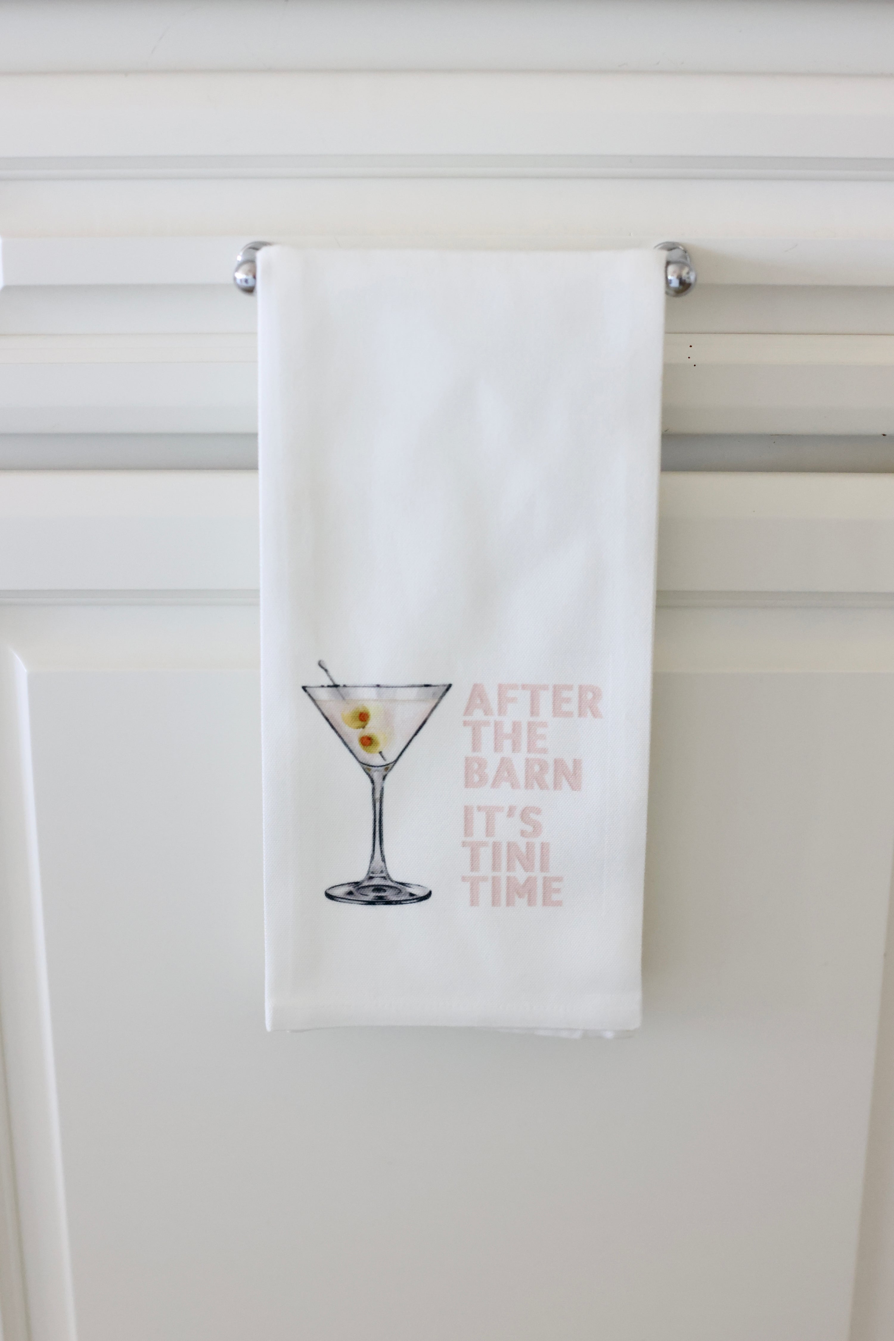 Toss Designs Tini Time Hand Towel | White tea towel featuring an illustration of a martini with olives and text "After the barn it's 'tini time," | Tini Time hand towel, equestrian tea towel, horse lover kitchen towel, funny bar towel, martini tea towel with olives, after the barn towel, stylish equestrian home decor, polyduck tea towel, horse girl gift, made in USA hand towel
