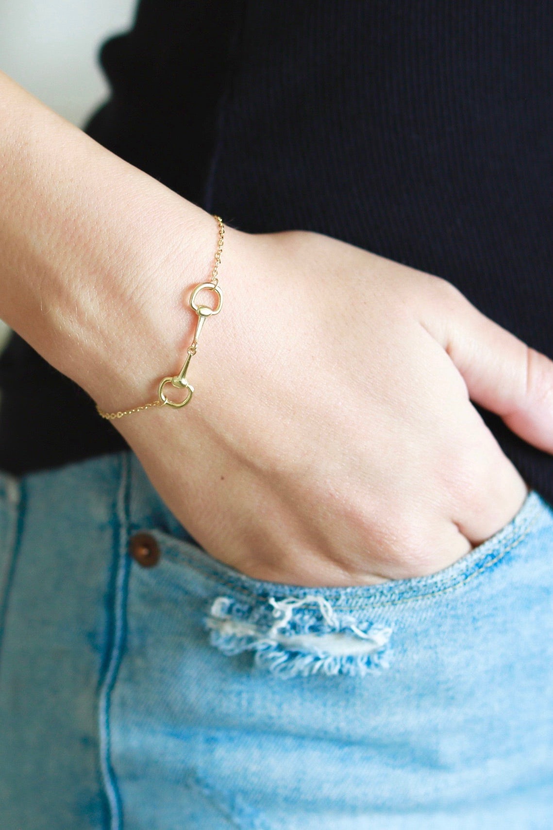 stylish equestrian dainty horse bit bracelet | Equestrian-inspired sterling silver bracelet featuring a delicate chain and center horse bit detail, adjustable for fit.
