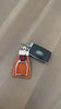 Cognac leather Stylish Equestrian Em Stirrup Key Ring with red and green stripe